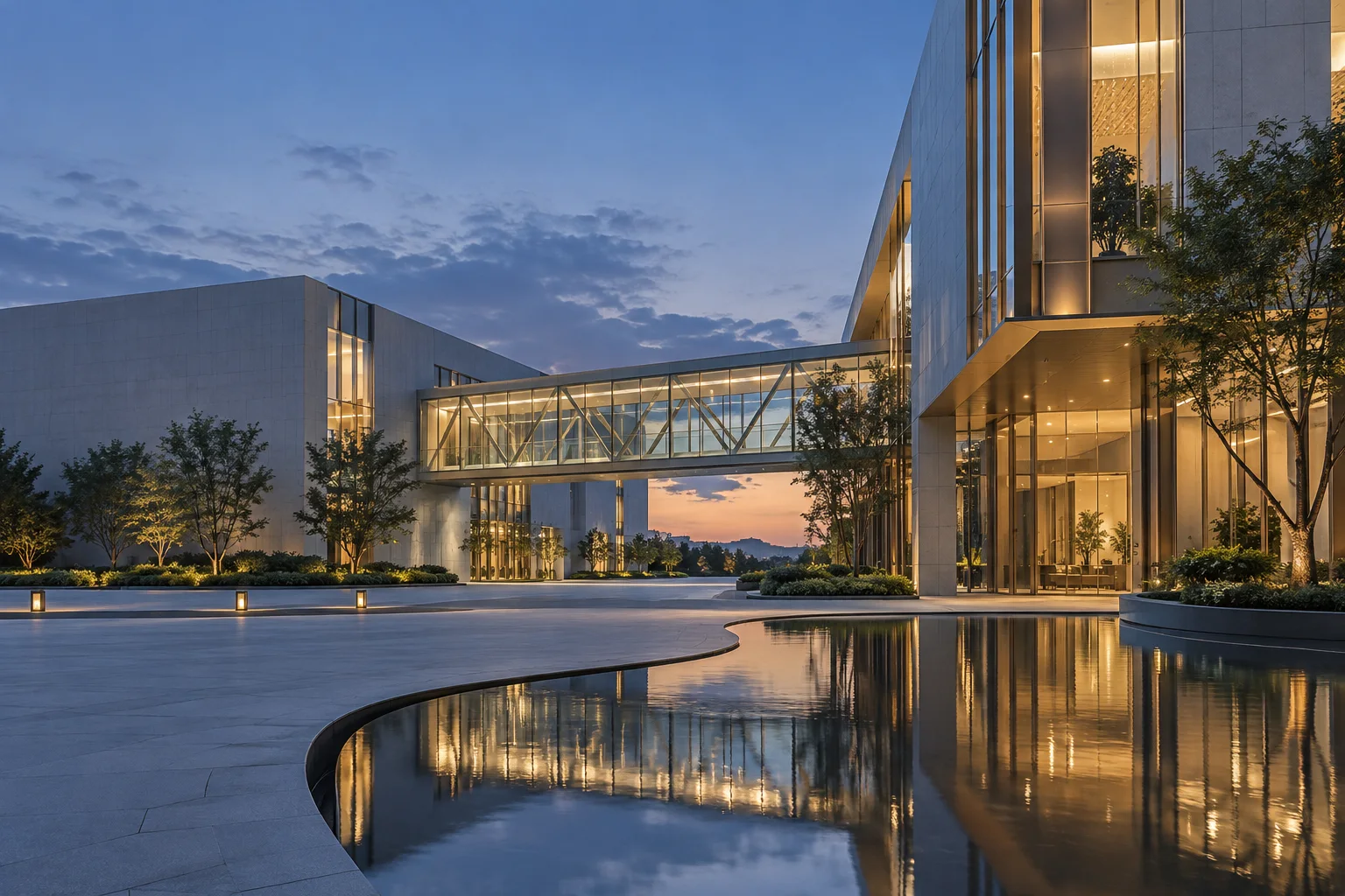 两翼不同材质的建筑通过通透廊桥相连,体量真实克制,以空间关系表达调整与协同