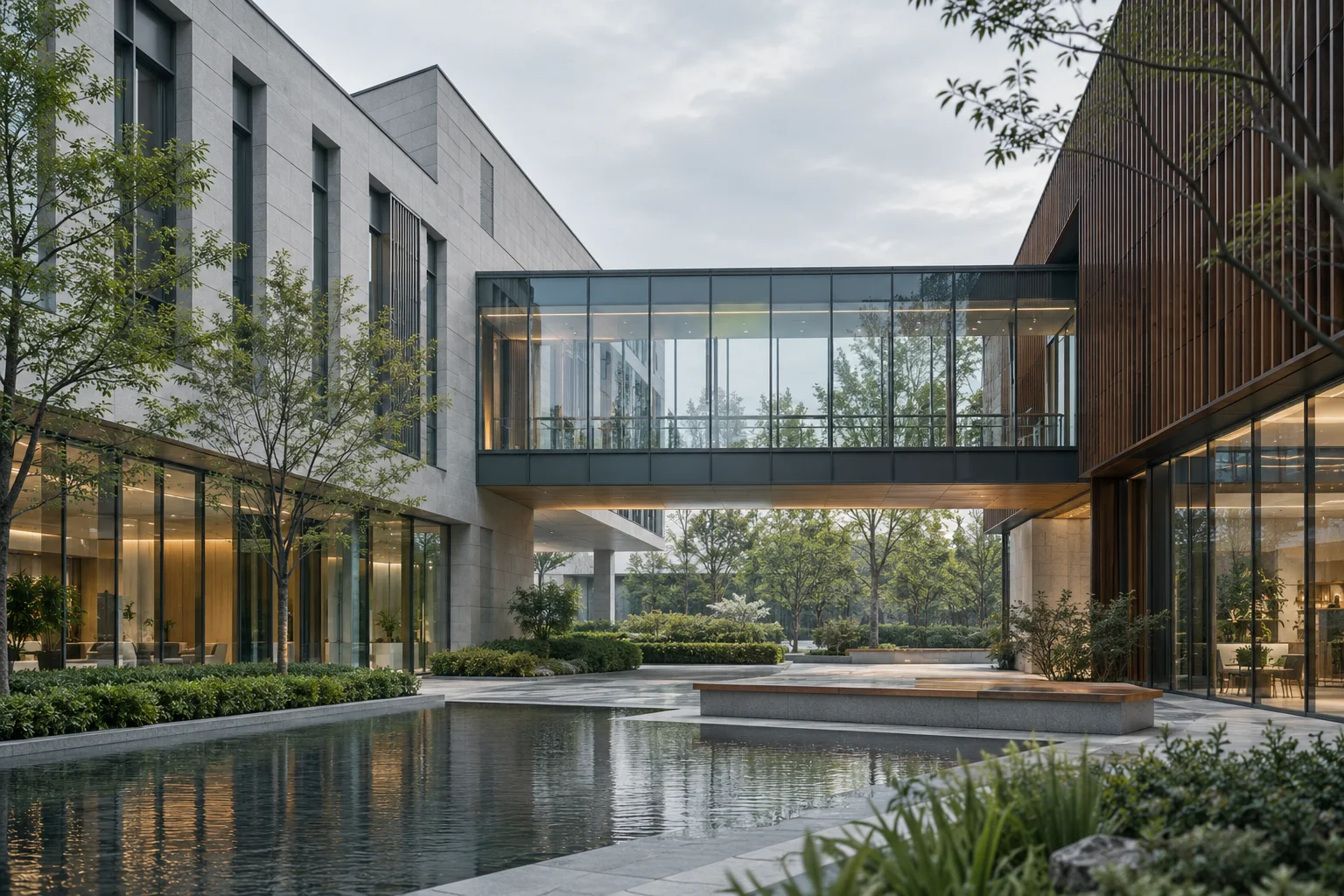 两翼不同材质的建筑通过通透廊桥相连，体量真实克制，以空间关系表达调整与协同
