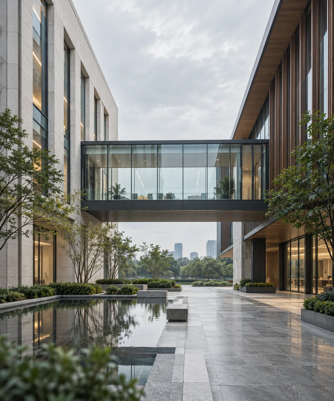 两翼不同材质的建筑通过通透廊桥相连，体量真实克制，以空间关系表达调整与协同