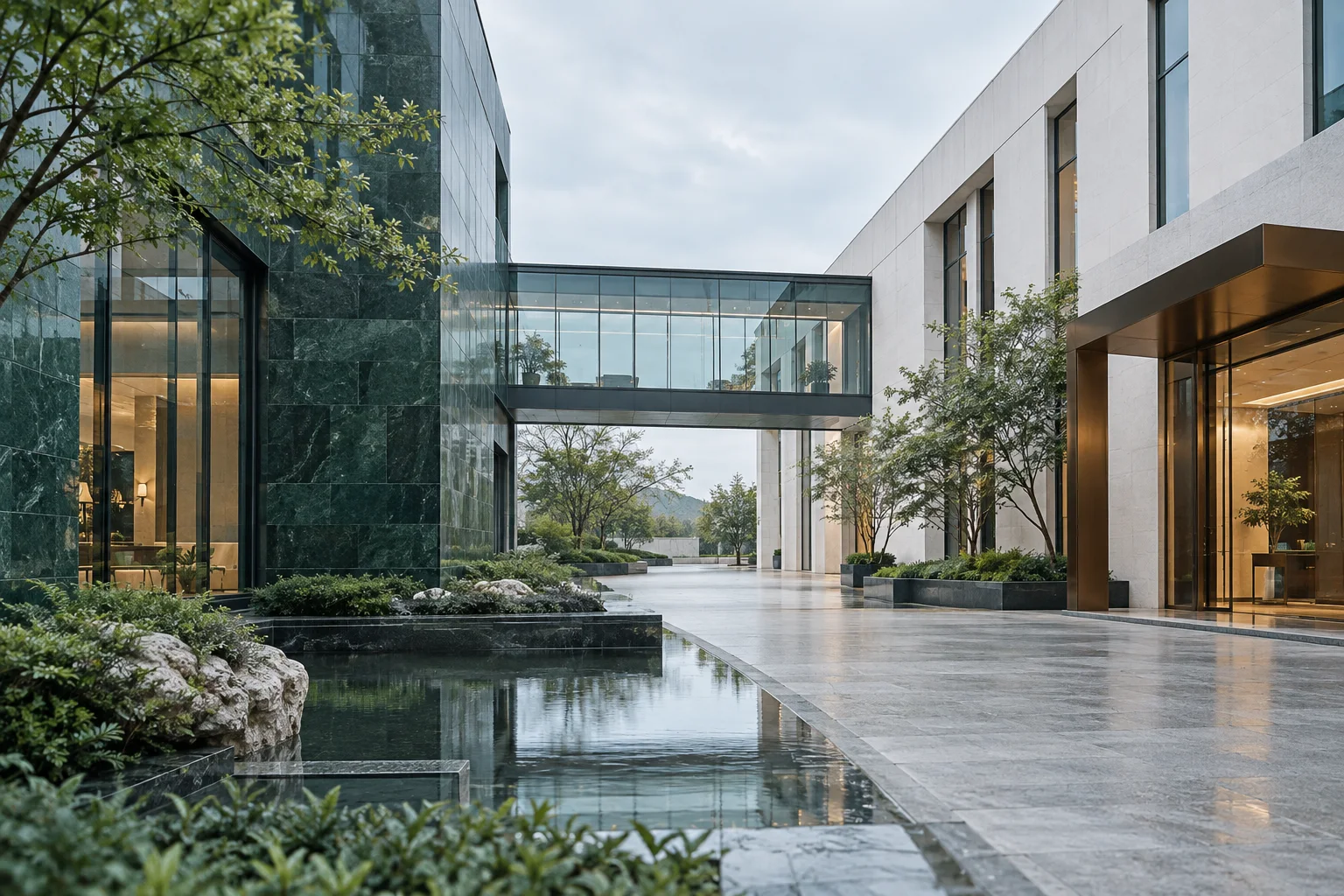 两翼不同材质的建筑通过通透廊桥相连，体量真实克制，以空间关系表达调整与协同