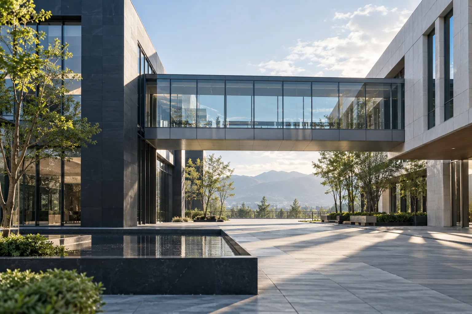 两翼不同材质的建筑通过通透廊桥相连，体量真实克制，以空间关系表达调整与协同